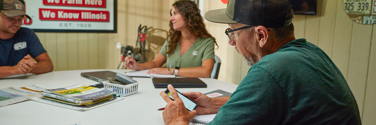 three people in a meeting
